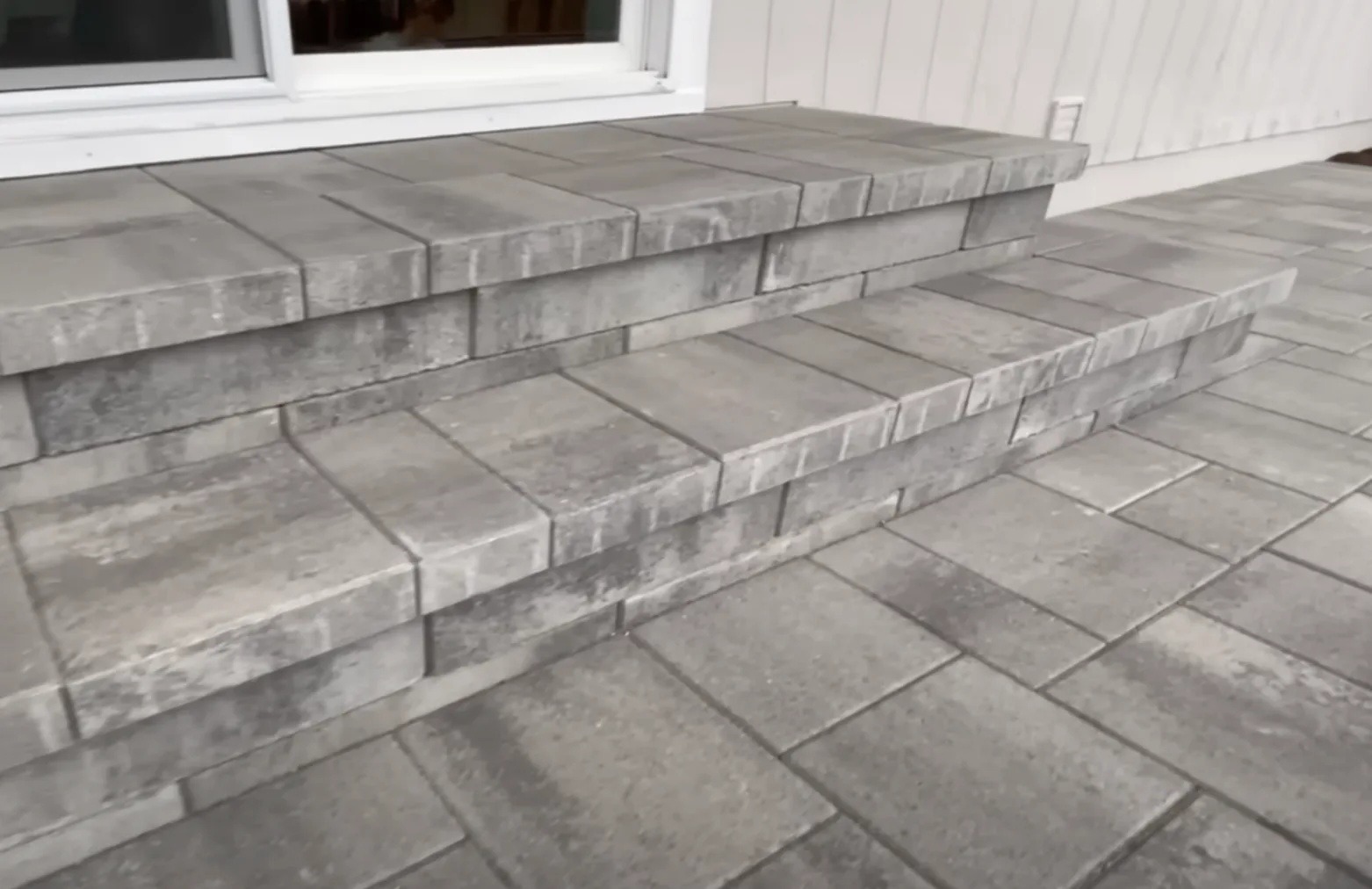 Paver steps leading to a home entrance