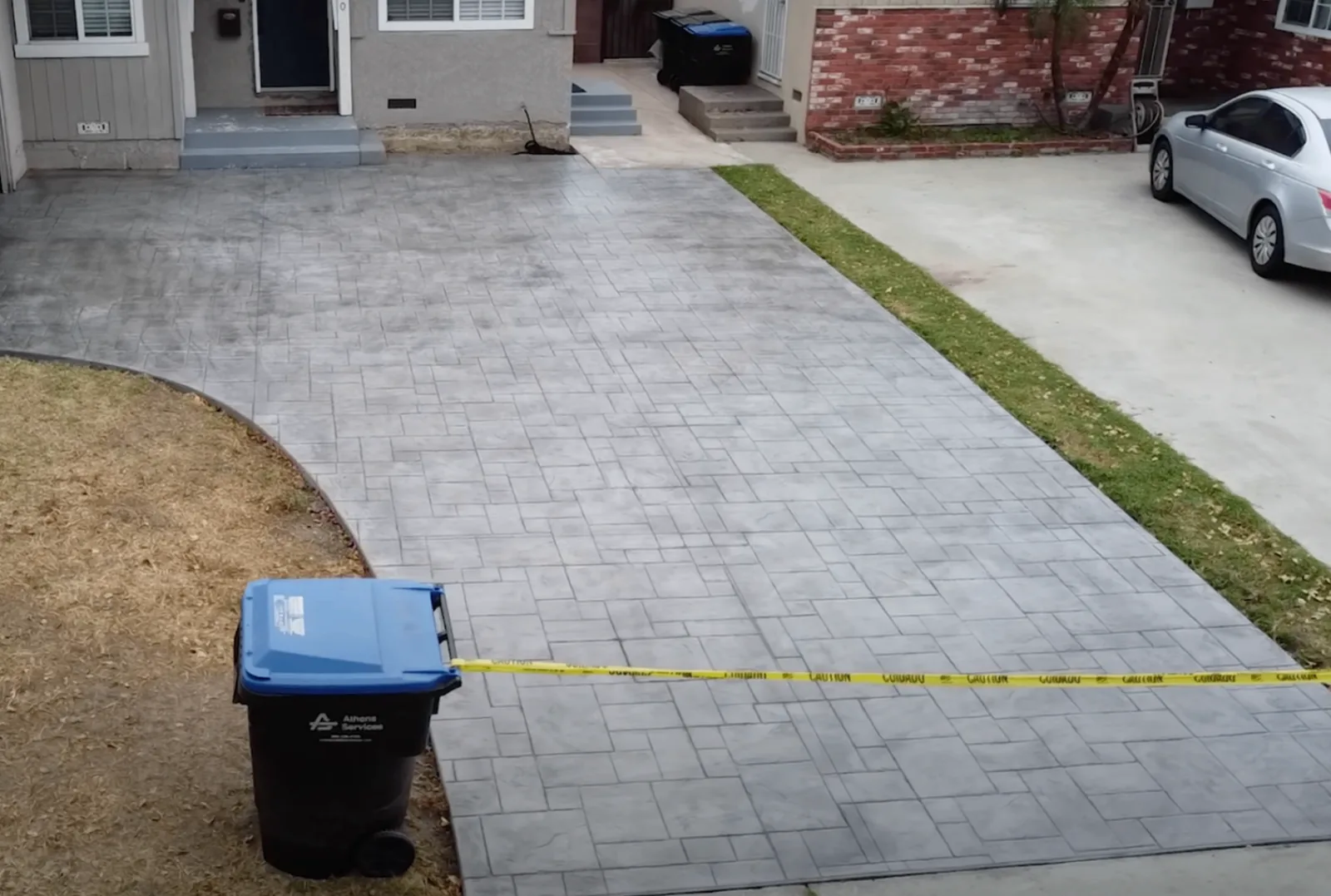 Paved driveway leading to a residential garage